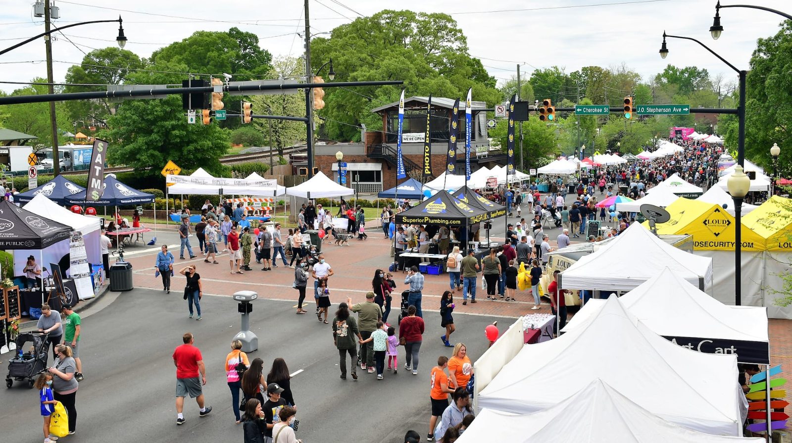 Crowds browsing vendor tents at the Big Shanty Festival in downtown Kennesaw