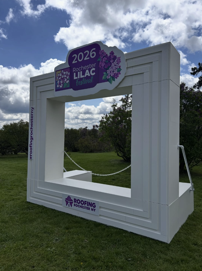 White branded photo experience frame installed outdoors